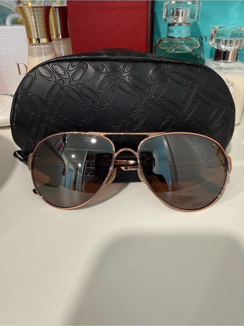 Oakley women’s Polarized Aviator Sunglasses - Rose Gold Frame, Brown Lenses